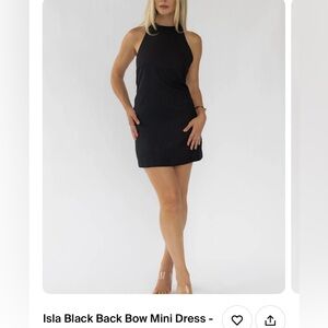 NEW! Little black dress with high halter neckline and bow tie in the back.